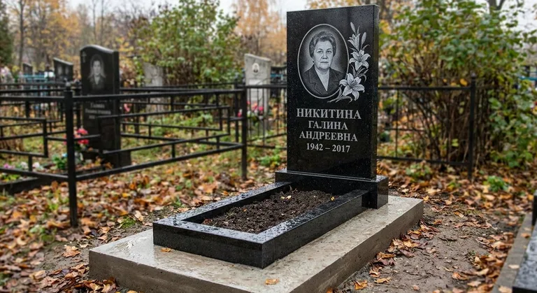 Памятник с гравировкой лилий — выполненная работа «Никитина» в Южно-Сахалинске