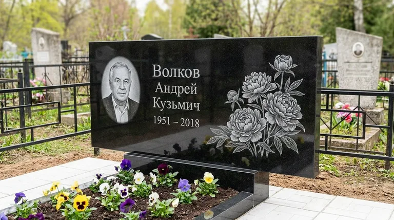 Памятник с гравировкой пионов — выполненная работа «Волков» в Южно-Сахалинске