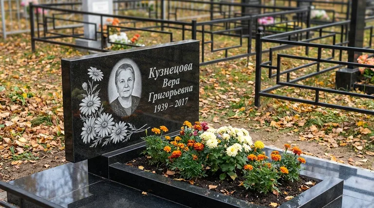 Памятник с гравировкой ромашек — выполненная работа «Кузнецова» в Южно-Сахалинске