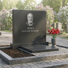 Памятник из тёмного базальта в форме монолитной глыбы